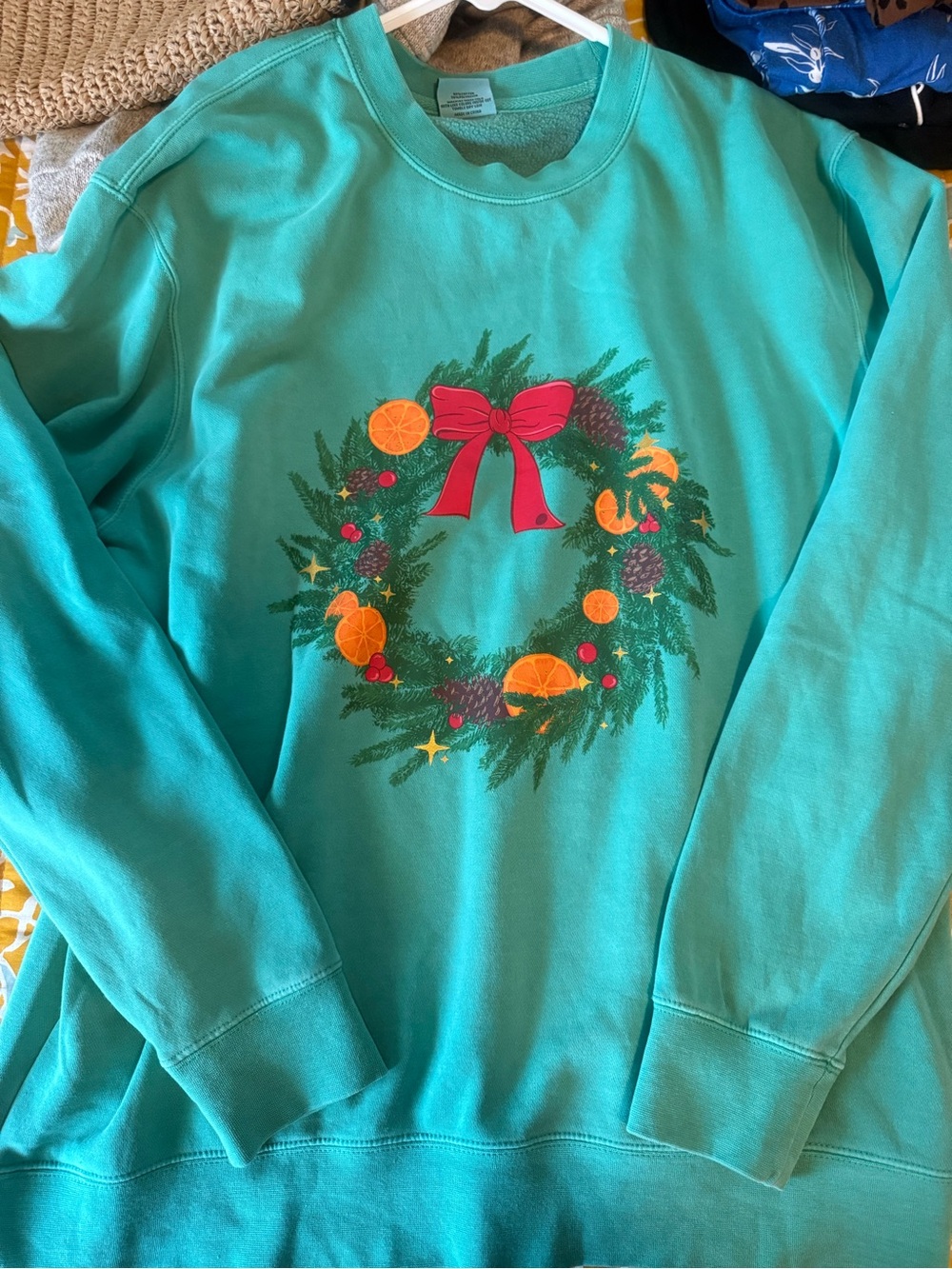 Living Fully Mallory Ervin Teal Holiday Wreath Sweatshirt with Red Bow